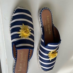 Pair of navy striped slip ons.